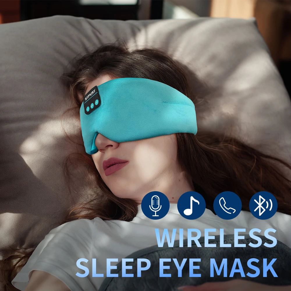 Person wearing a wireless sleep eye mask with control buttons on a pillow