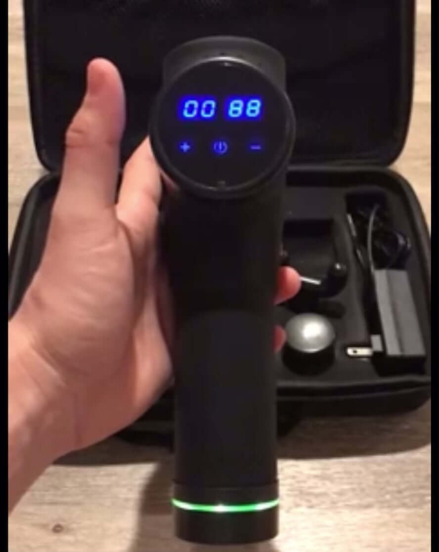 massage gun in use and switching to different intensity levels